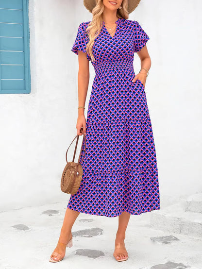 Mila - Vestido midi floral con cuello en V