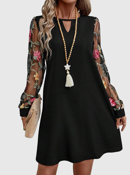Martina - Elegante vestido con escote en V y mangas llamativas