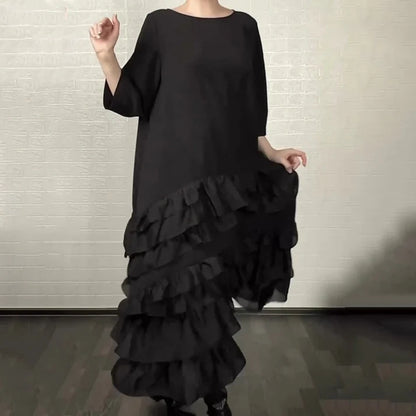 Eva – Vestido oversize fluido con volantes y capas