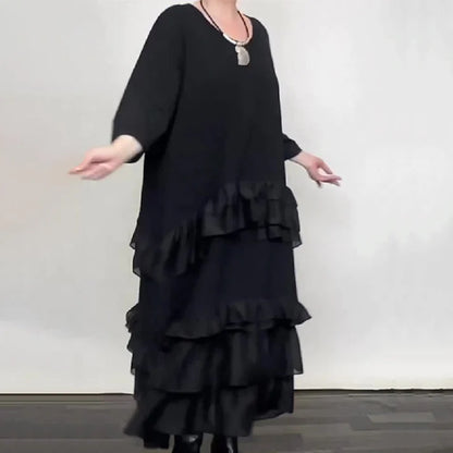 Eva – Vestido oversize fluido con volantes y capas